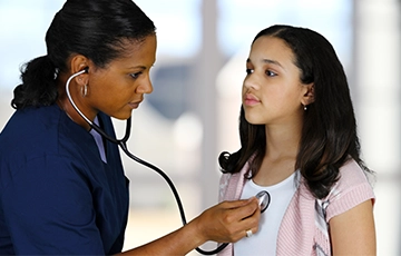 Female provider examining a young female