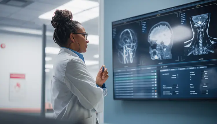 physician reviewing scans