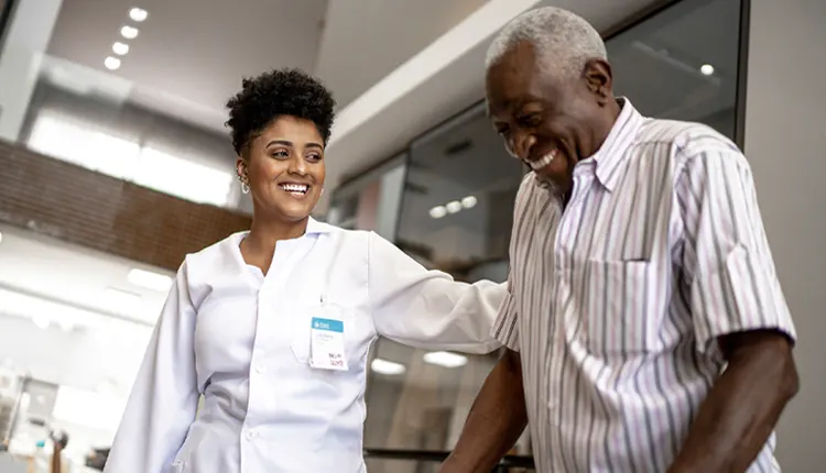 physician helping man